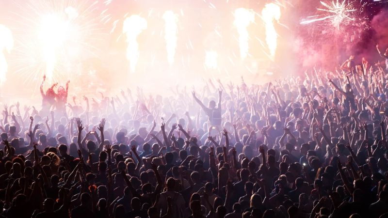 Image of crowd at a festival for seven essential steps in creating a festival line up